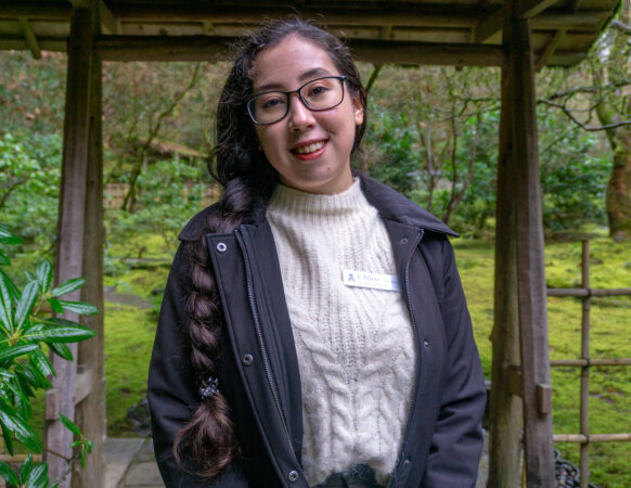 Chloe Lee, an intern and volunteer for Portland Japanese Garden, standing in the Tea Garden.